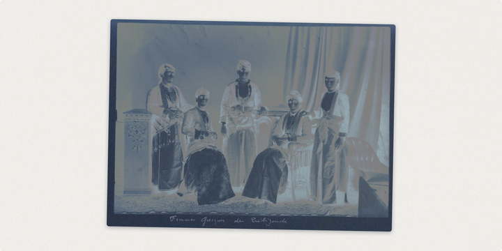 The image is a vintage cyanotype of Greek women from Trabzon in traditional dress on a terrace